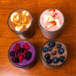 4 high protein smoothies hero shot &ndash; colorful healthy breakfast smoothie recipes with fresh fruit