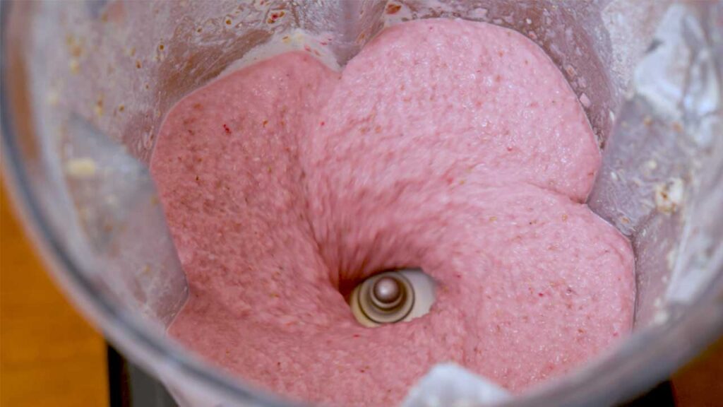 4 high protein smoothies close-up &ndash; colorful berry smoothie with fresh blueberries and strawberries on top