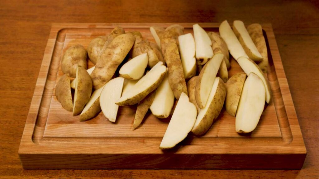 How to make potato wedges – step 1: cutting russet potatoes into thick wedges