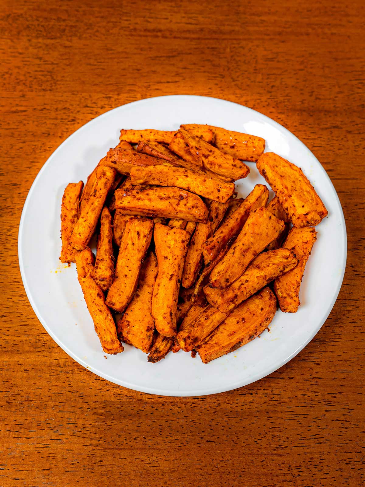Air fryer sweet potato fries in bowl &ndash; crispy high-protein healthy snack side dish