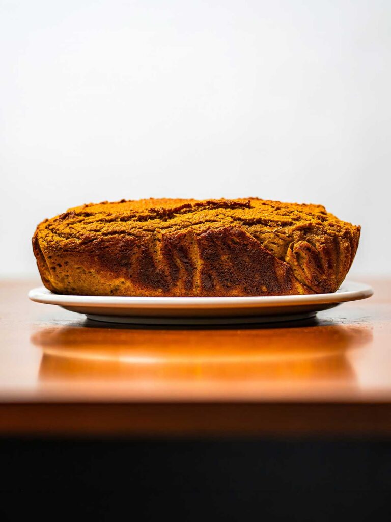 Almond flour protein pumpkin bread hero &ndash; sliced high-protein pumpkin bread on rustic wooden surface