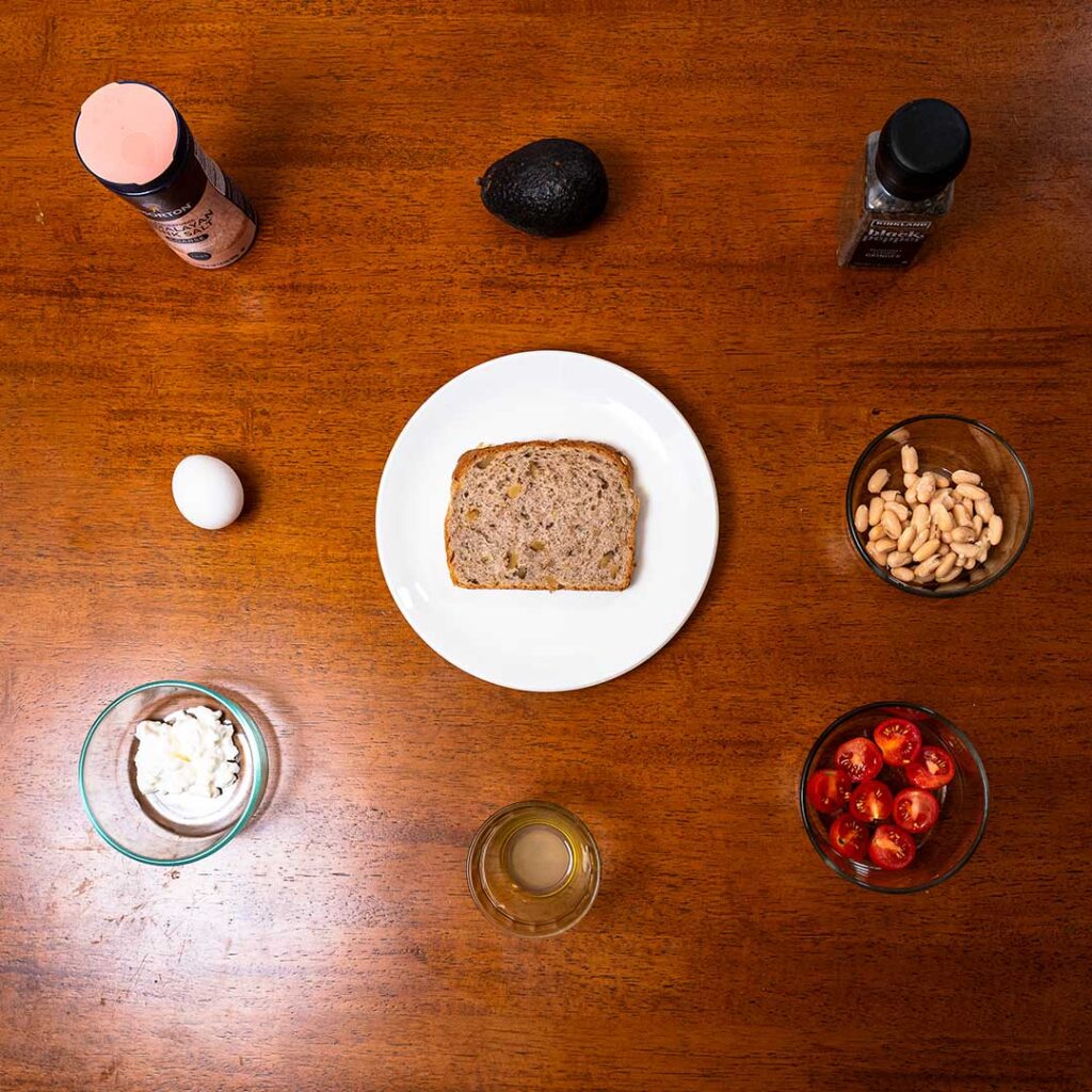 Avocado toast ingredients &ndash; avocado, eggs, and whole wheat bread for a high-protein breakfast recipe
