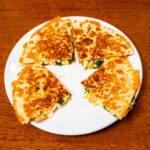 Breakfast quesadilla hero shot &ndash; high-protein breakfast with eggs, chicken, and cheese on golden tortilla