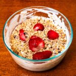 Cheesecake protein yogurt bowl hero shot &ndash; high-protein breakfast recipe with berries and granola