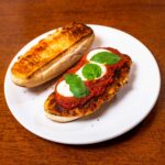 High-protein chicken parmesan sandwich &ndash; breaded chicken with melted mozzarella on ciabatta