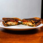 Chicken pesto sandwich on fresh bread &ndash; high-protein lunch with basil pesto