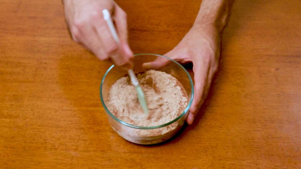 Making chocolate chia seed protein pudding &ndash; mixing chia seeds and protein powder for high-protein overnight dessert