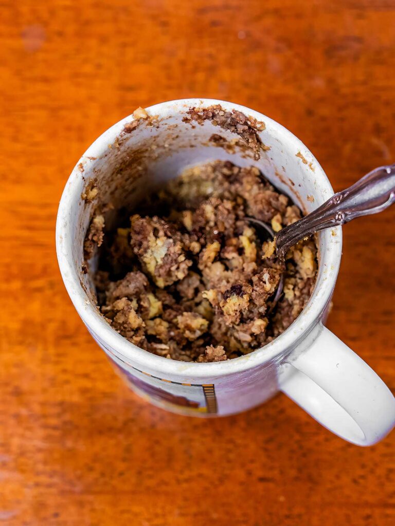 Chocolate chip banana protein mug cake in a microwave-safe mug &ndash; quick high-protein dessert