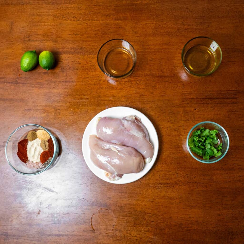 Cilantro lime chicken ingredients &ndash; chicken breast, fresh cilantro, limes for high-protein dinner recipe