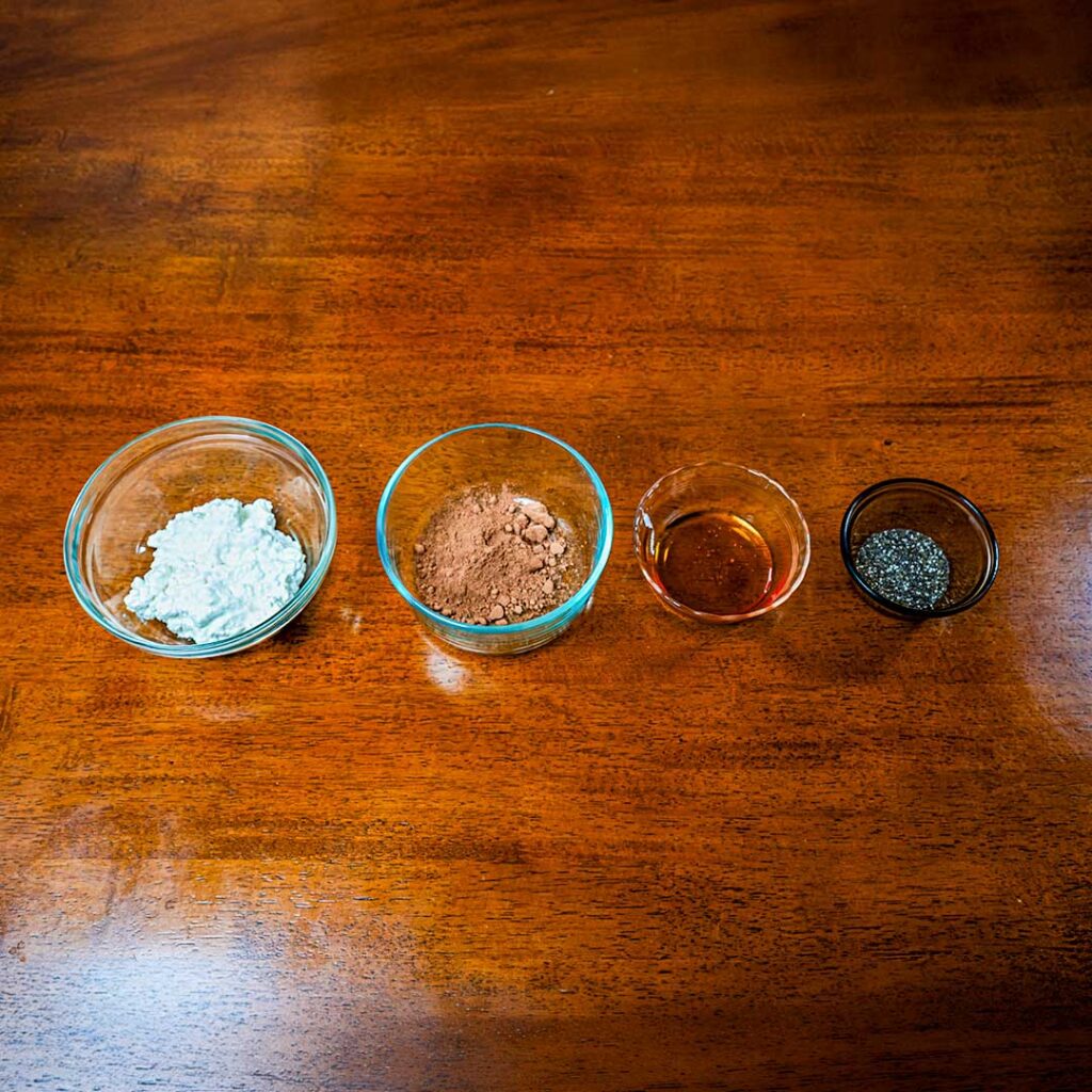 Cottage cheese chocolate mousse ingredients &ndash; cottage cheese, cocoa powder, protein powder for high-protein recipe
