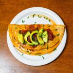 Cottage cheese omelette hero shot &ndash; high protein fluffy breakfast on a white plate