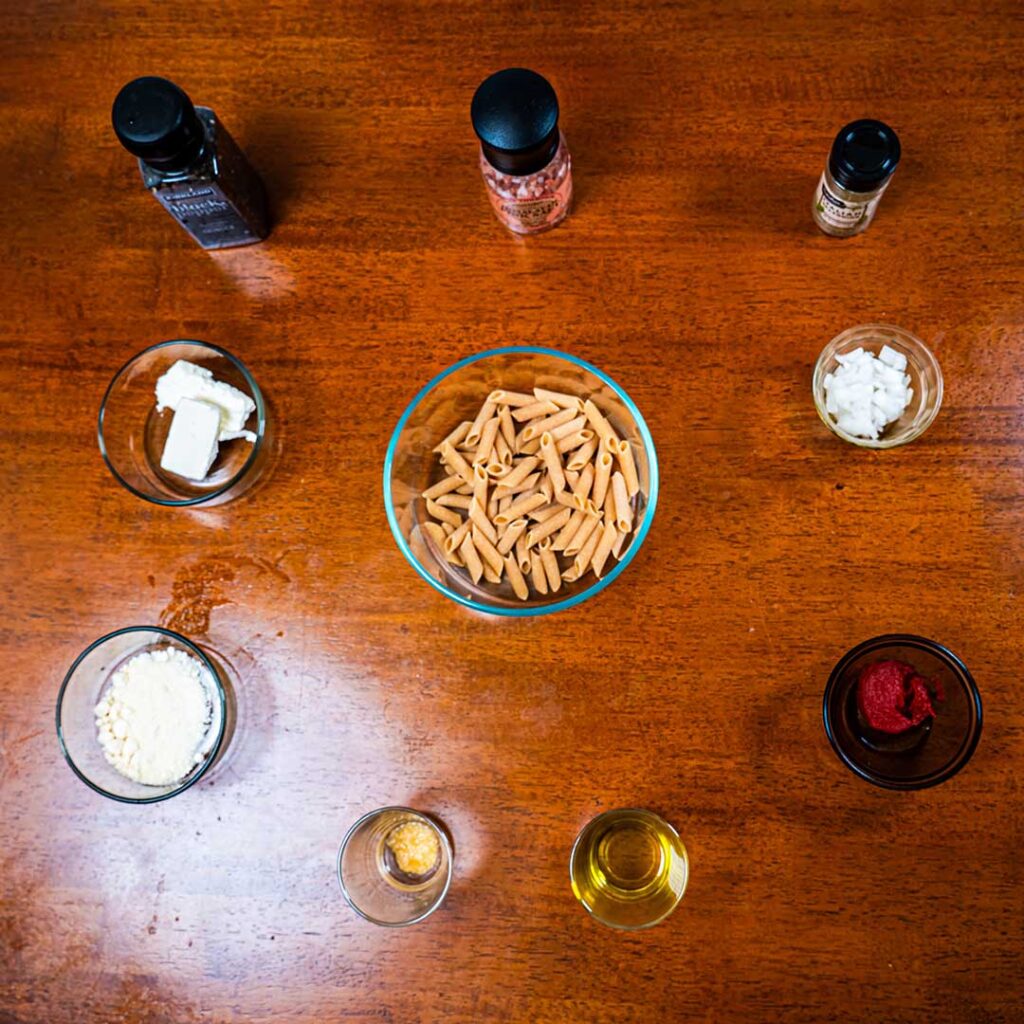 Tomato pasta ingredients &ndash; fresh tomatoes, pasta, herbs for a high-protein dinner recipe