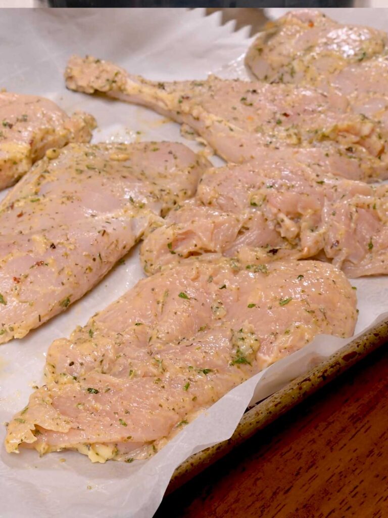 Italian herb chicken plated &ndash; high-protein dinner with roasted garlic and fresh rosemary garnish