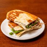 Low carb cottage cheese flatbread hero &ndash; soft high-protein flatbread with toppings on wooden board