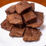 Low-carb protein chocolate cake bites on a white plate &ndash; high-protein healthy dessert recipe