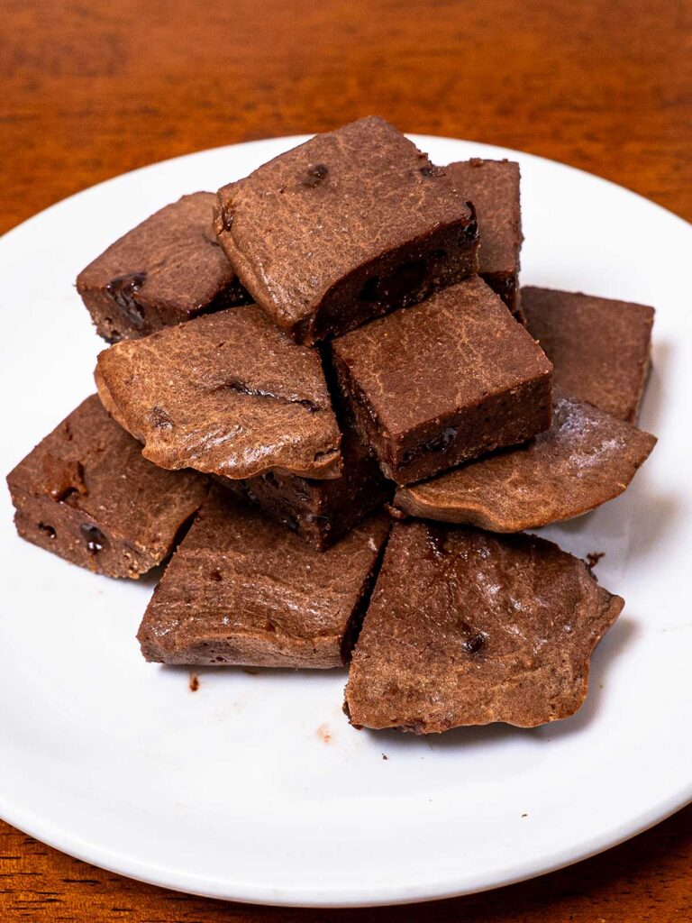 Low-carb protein chocolate cake bites on a white plate &ndash; high-protein healthy dessert recipe