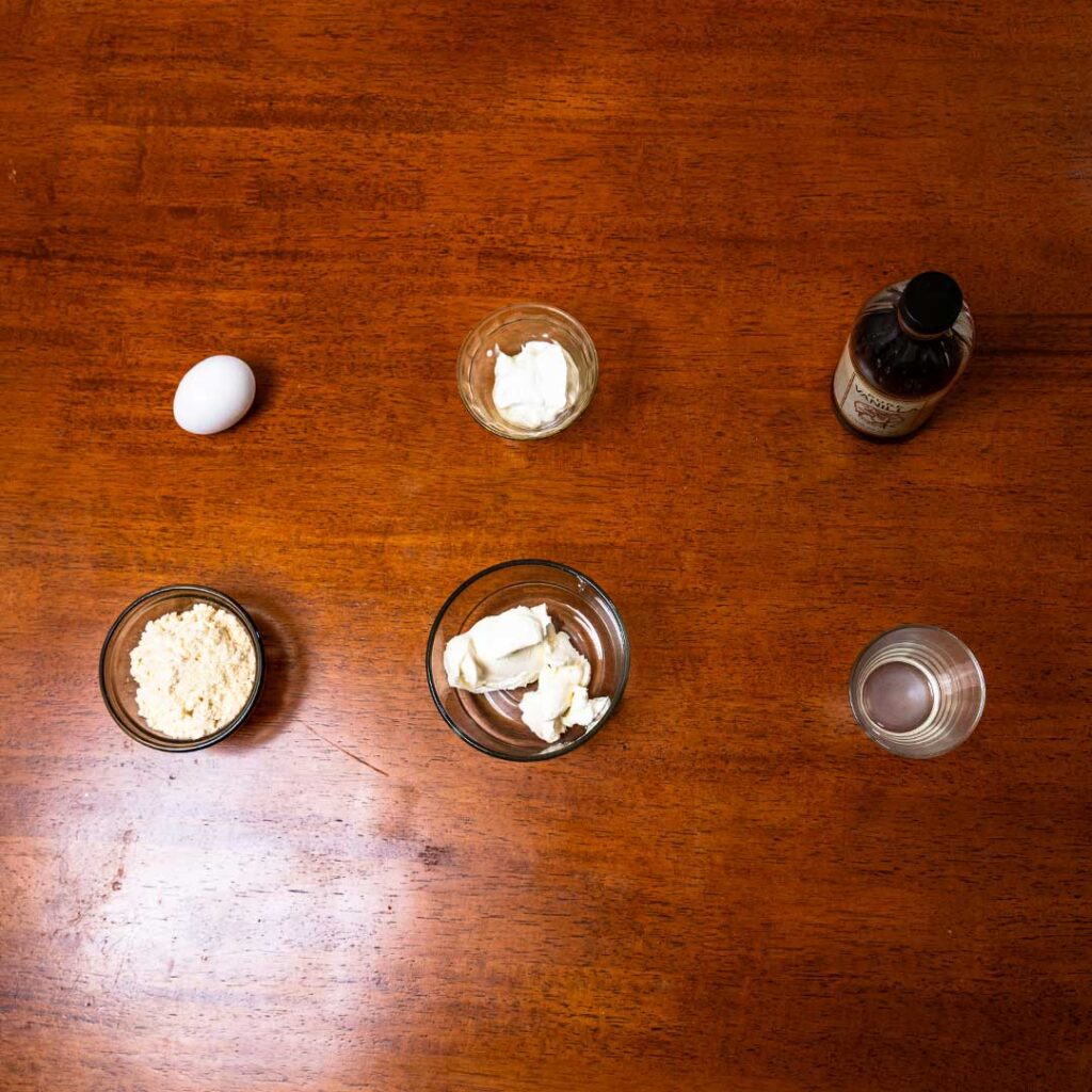 Microwave cheesecake ingredients – cream cheese, Greek yogurt, protein powder for high-protein dessert