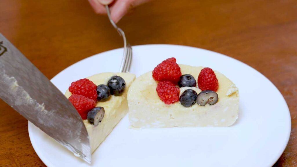 Microwave cheesecake overhead flat lay – high-protein dessert with ingredients arranged around ramekin