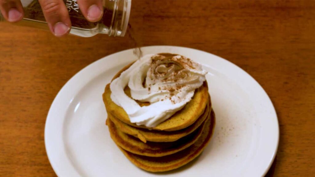 How to make protein pumpkin pancakes &ndash; step 4: flipping golden brown pancakes on skillet