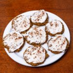 Pumpkin oatmeal cookies hero &ndash; stack of soft high-protein healthy cookies on rustic surface