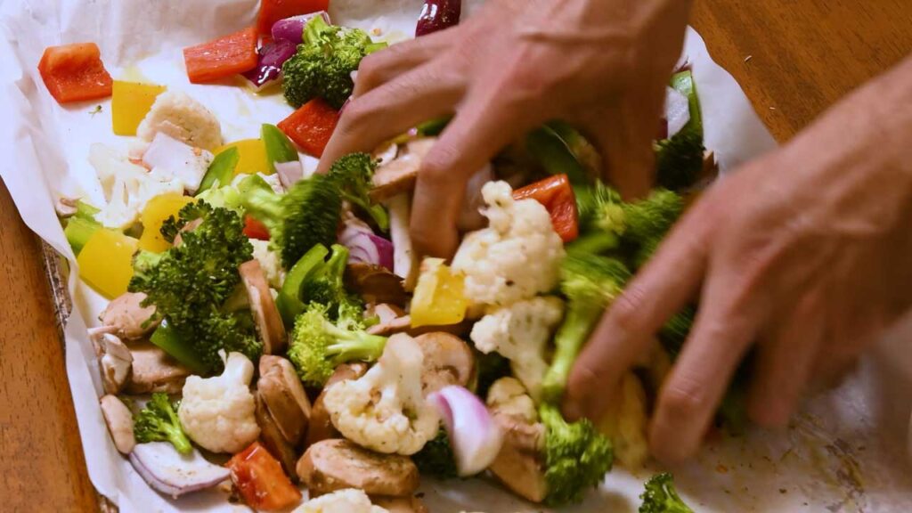 Roasted vegetables plated &ndash; colorful vegetable medley served on white plate with herbs