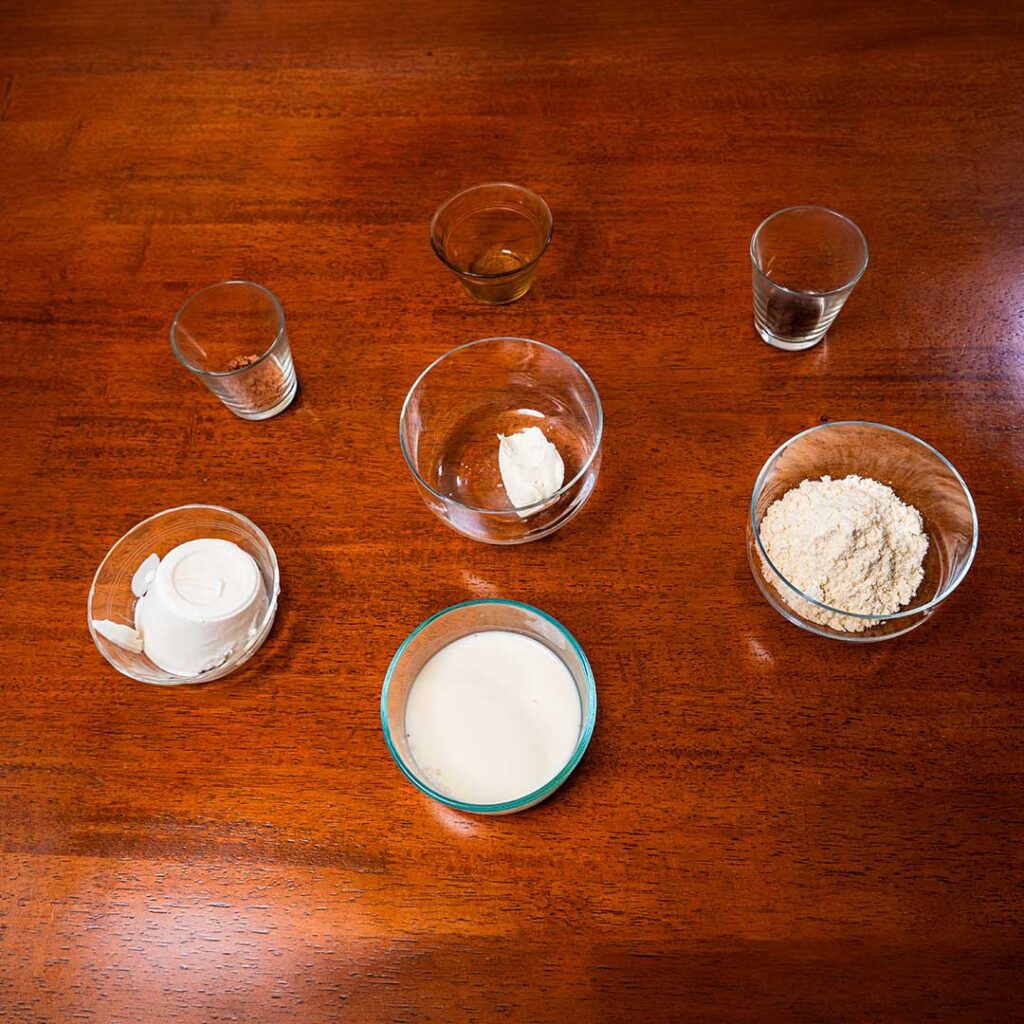 Tiramisu protein shake ingredients &ndash; coffee, Greek yogurt, cocoa powder for a high-protein smoothie