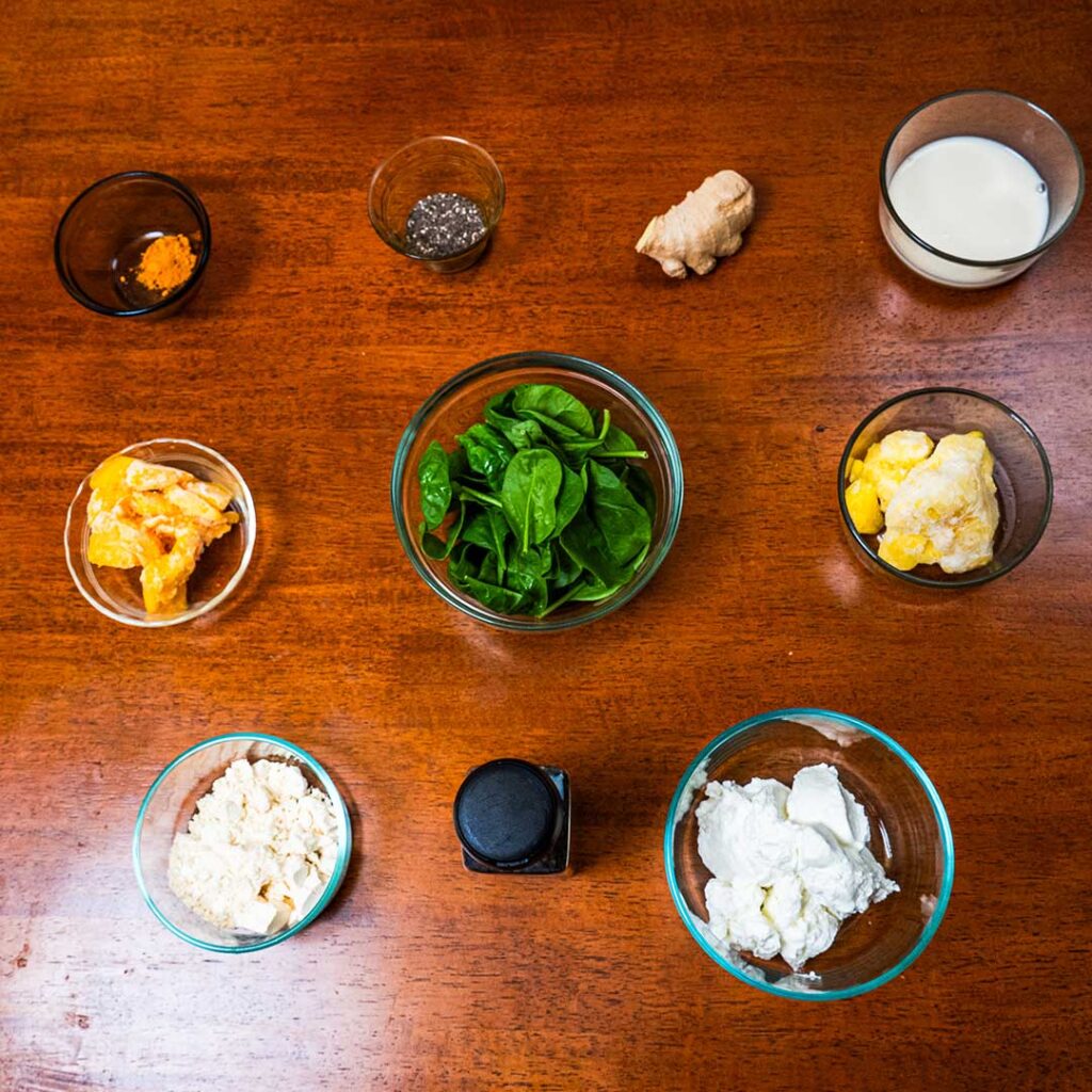 Tropical green protein smoothie ingredients &ndash; spinach, banana, pineapple for high-protein recipe