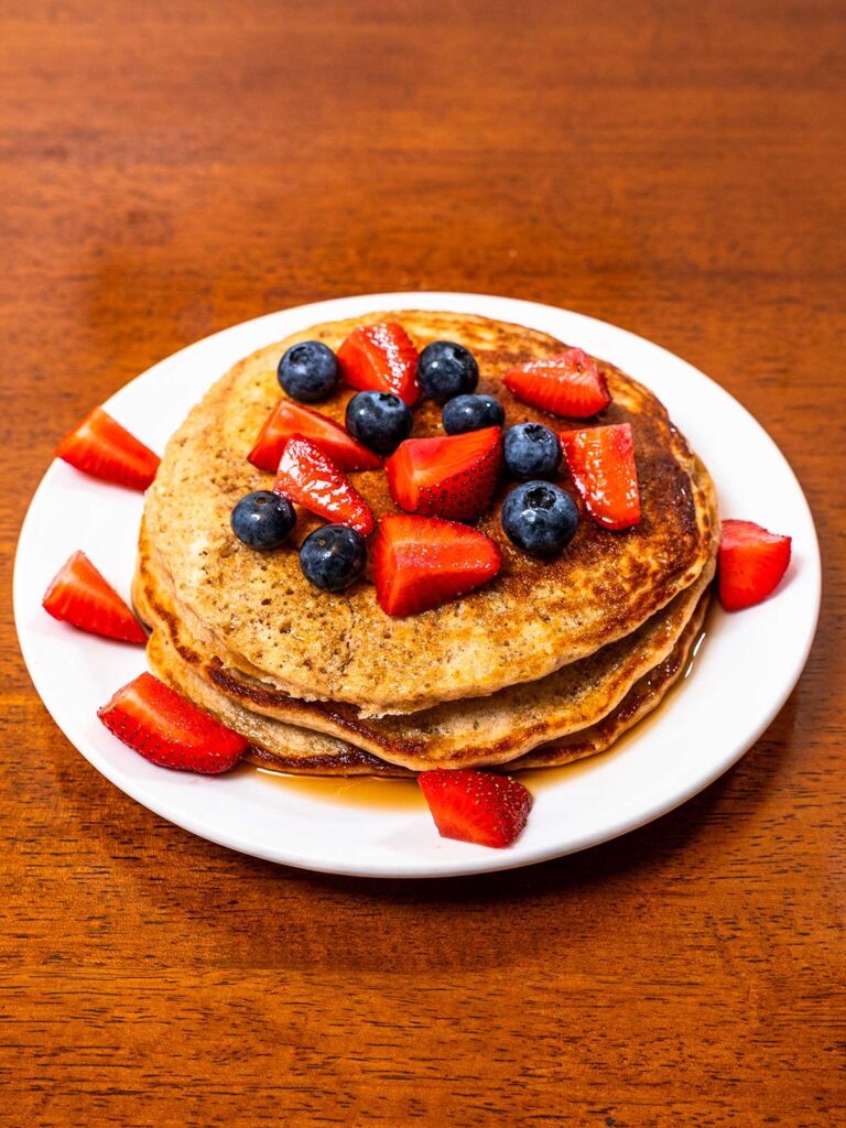 Vanilla protein pancakes finished on a white plate &ndash; easy high-protein breakfast recipe