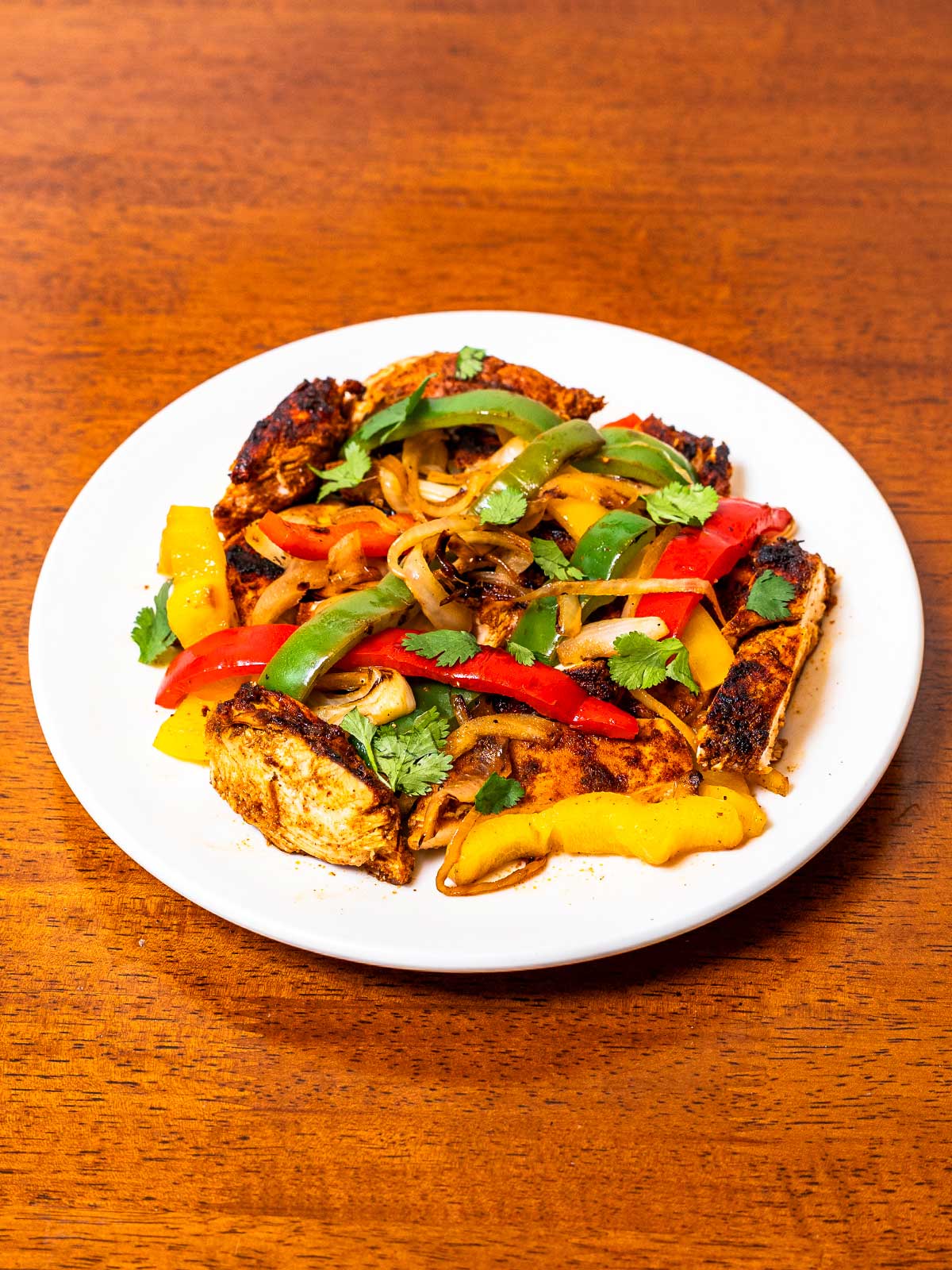 Chicken fajitas hero shot – high-protein sizzling chicken and peppers with tortillas