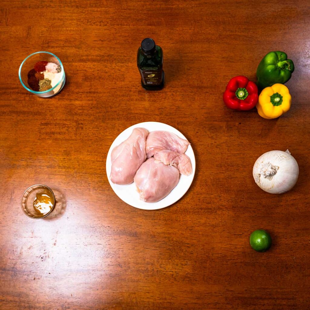Chicken fajitas ingredients – chicken breast, bell peppers, onions, tortillas for high-protein recipe