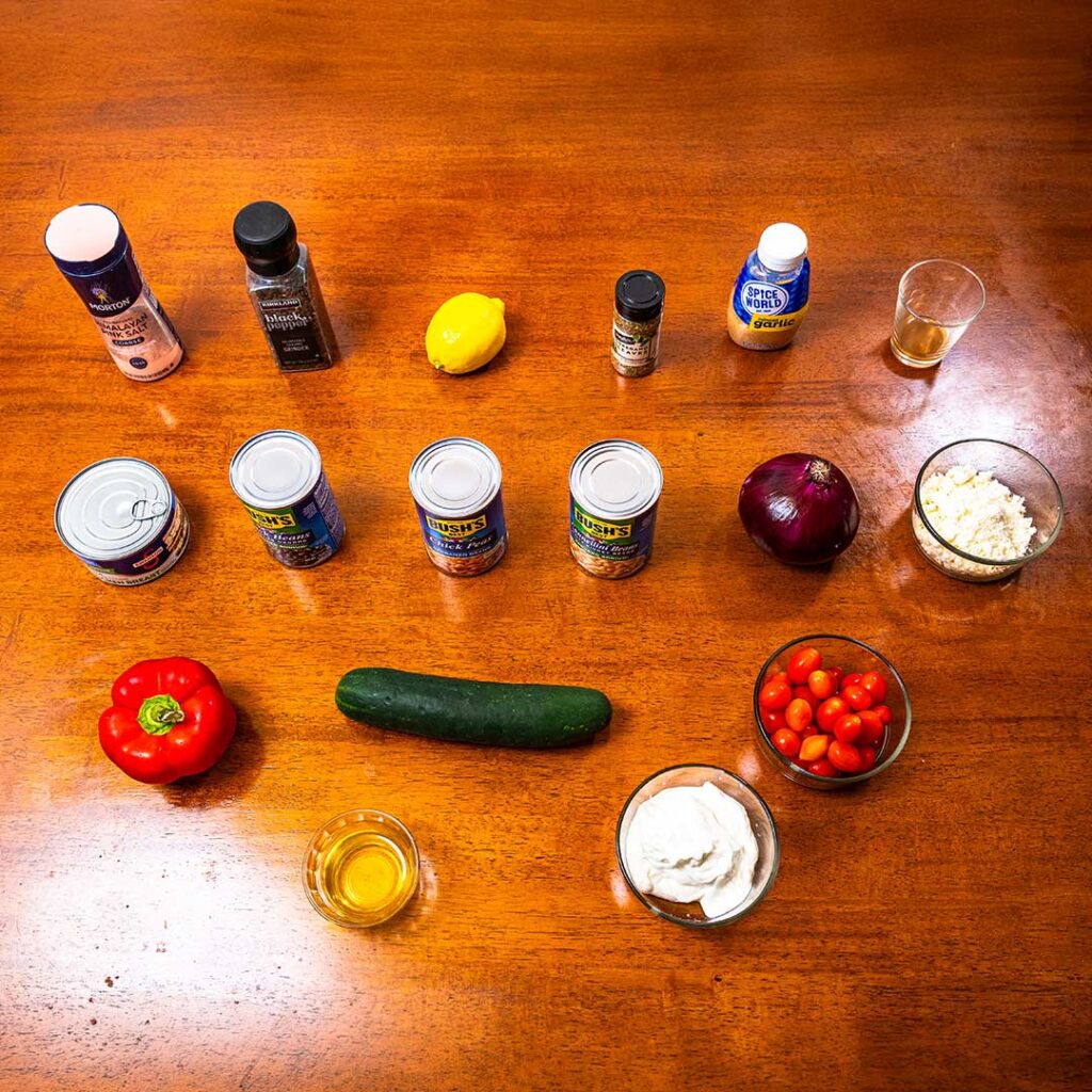 Dense bean salad ingredients – mixed beans, vegetables, dressing for high-protein recipe