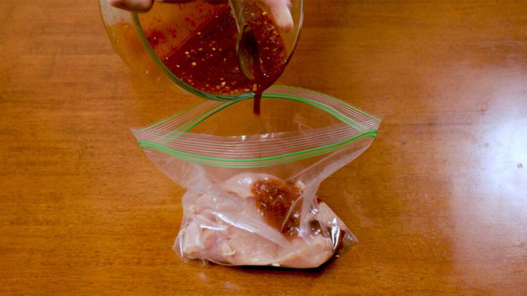 Making Korean chicken meal prep – step 1: marinating chicken in Korean BBQ sauce
