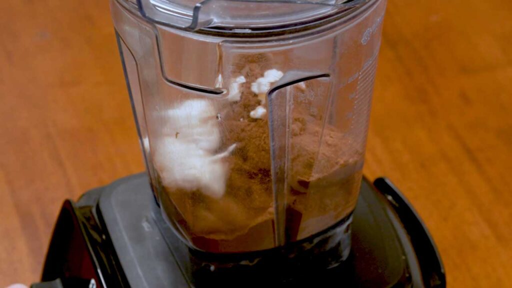 Chocolate peanut butter banana protein nice cream close-up, creamy high-protein frozen dessert