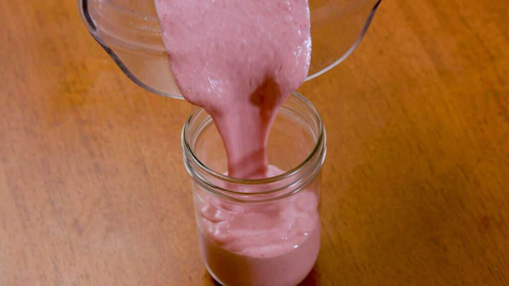 Cottage cheese strawberry ice cream side view, high-protein healthy dessert with fresh strawberries
