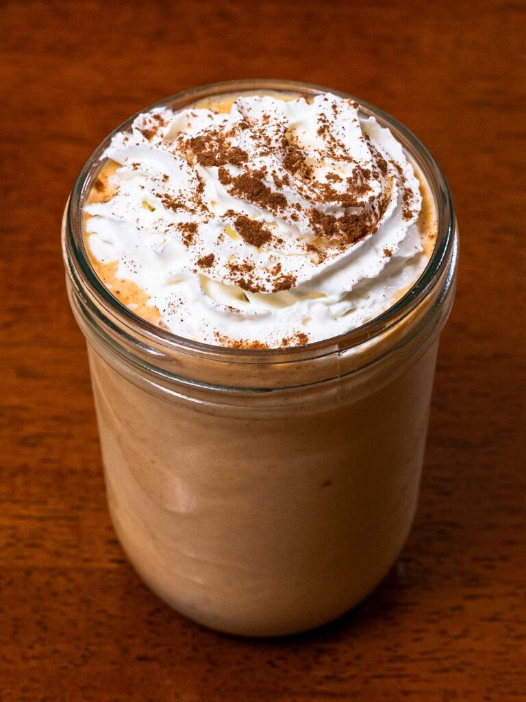 Pumpkin protein shake hero shot -- high-protein pumpkin smoothie in glass
