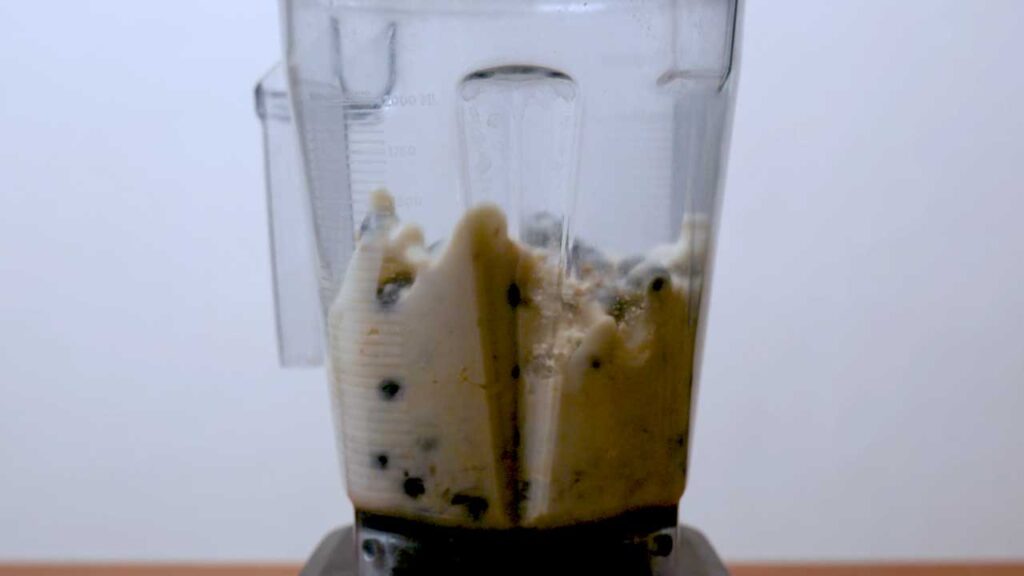 Blueberry vanilla protein smoothie in progress &ndash; easy high-protein smoothie recipe shot