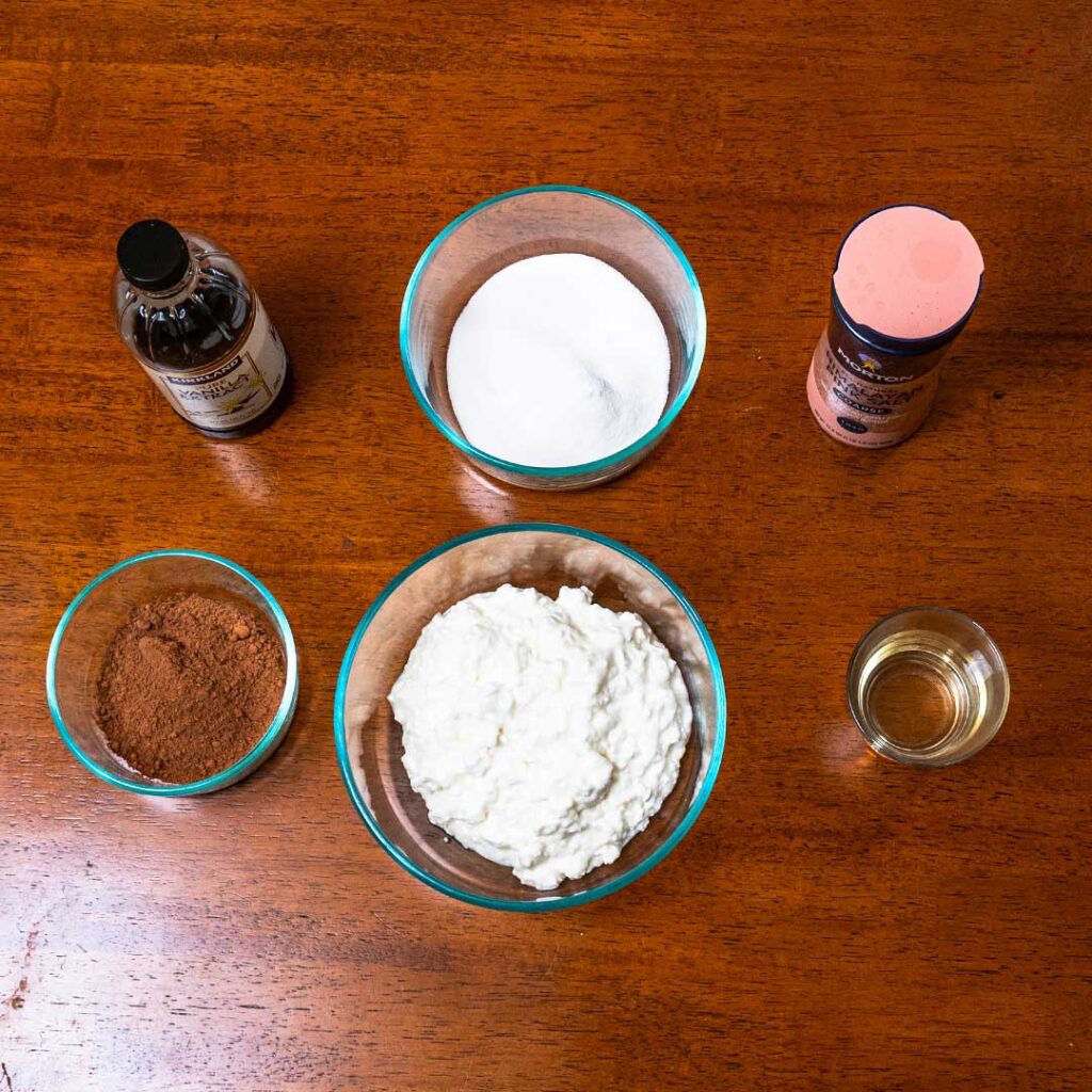 Cottage cheese chocolate ice cream ingredients &ndash; cottage cheese, cocoa powder, protein powder for high-protein dessert