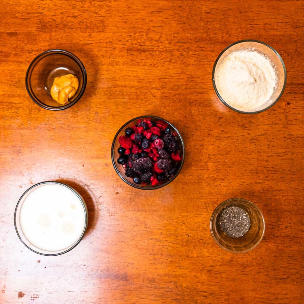 Mixed berry protein smoothie ingredients – mixed berries, vanilla, and protein powder