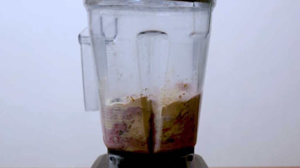 Mixed berry protein smoothie in progress – easy high-protein smoothie recipe shot