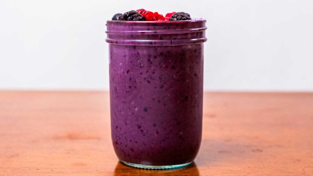 Mixed berry protein smoothie final pour – high-protein easy smoothie recipe photo