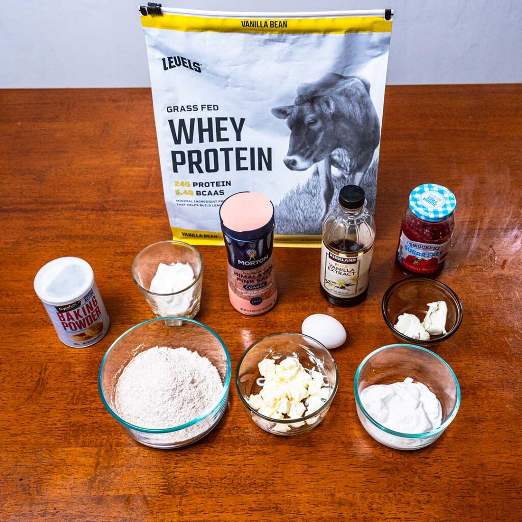 Protein strawberry poptarts ingredients, protein powder, strawberry jam, and flour for a high-protein recipe