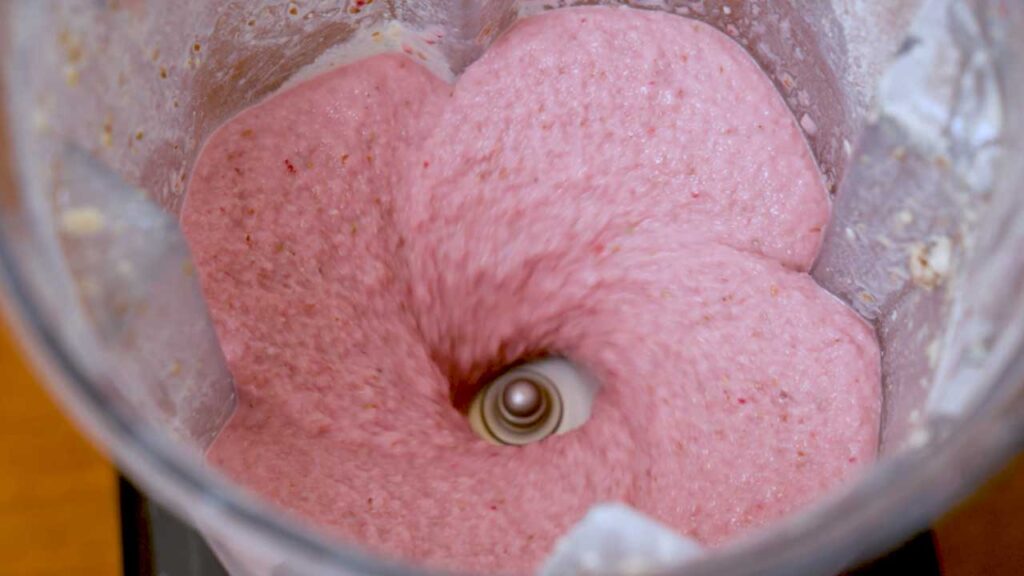 Making a strawberry banana protein smoothie &ndash; quick high-protein recipe process photo