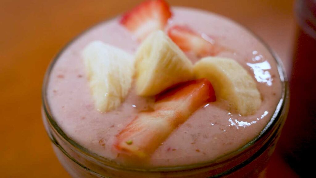 Strawberry banana protein smoothie final pour &ndash; high-protein easy smoothie recipe photo