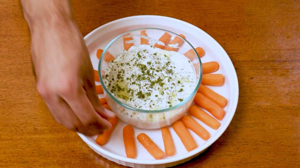 How to make whipped cottage cheese garlic dip &ndash; step showing seasoning and flavor adjustment