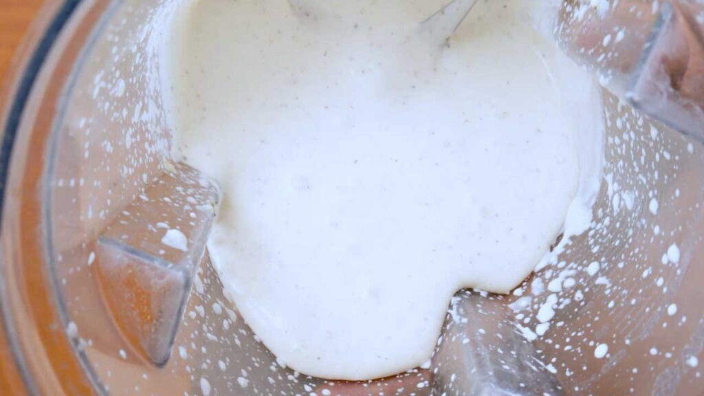 Smooth cottage cheese alfredo sauce in a blender before mixing with the pasta