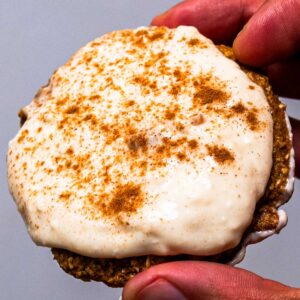 Gingerbread protein cookie with white icing and cinnamon, a high-protein treat