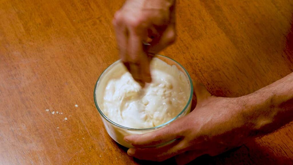 Whisking the white icing for gingerbread protein cookies